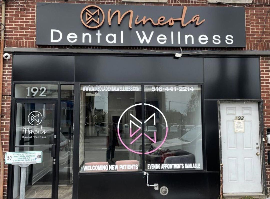 A dental wellness clinic is located on a brick building