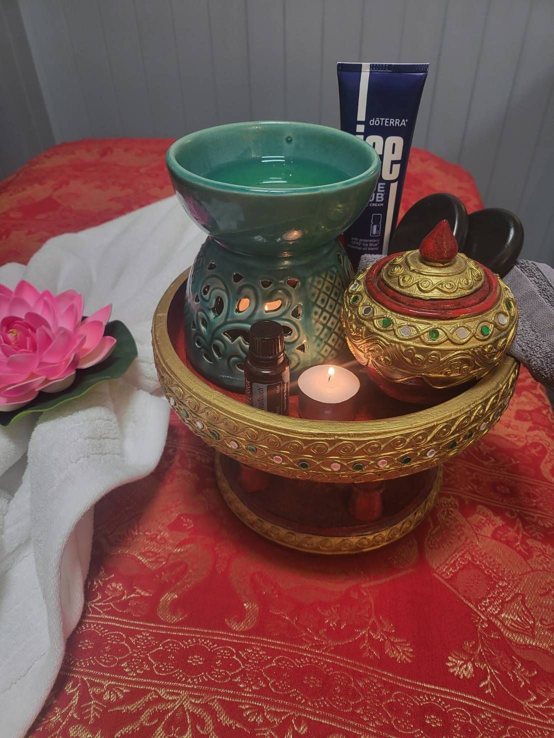 A table with a candle and hot oil for massage at Sarah's Thai Massage Paradise Point.