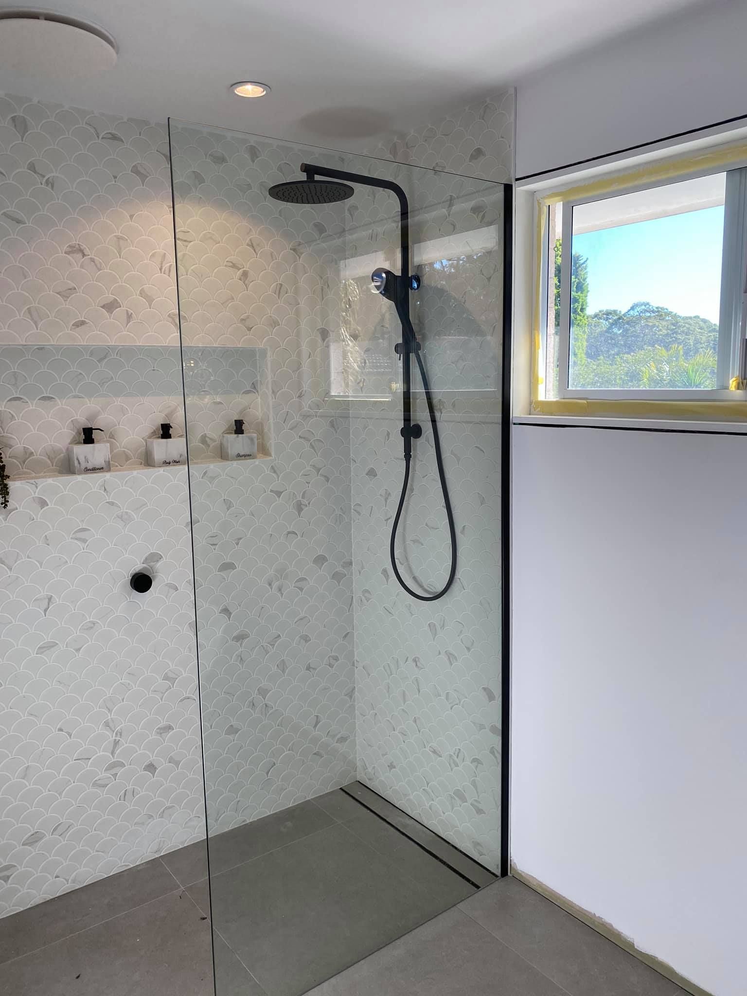Modern Shower with Glass Door, Black Fixtures, and Mosaic Tile — Master Glass & Glazing in Toronto, NSW