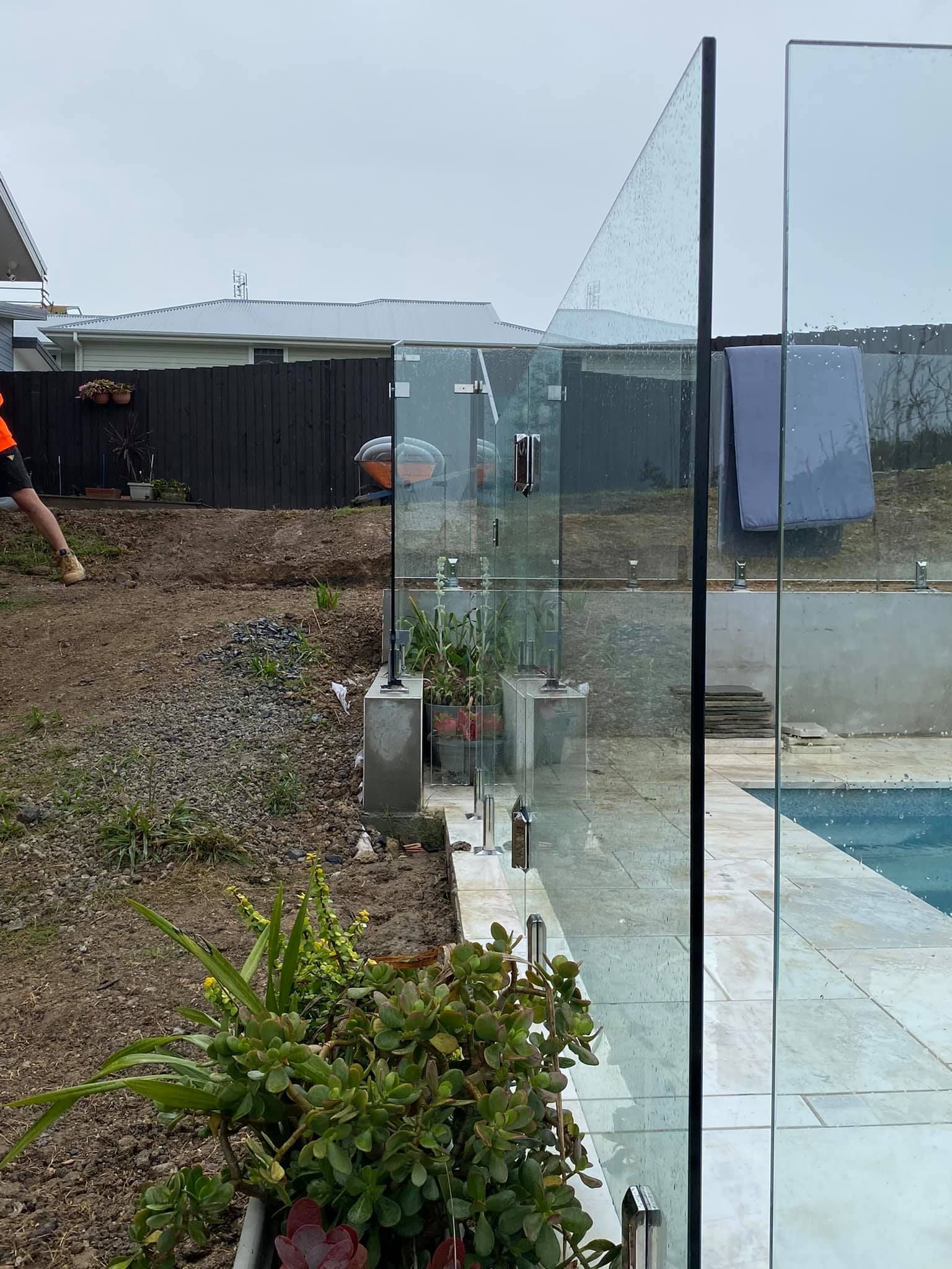 Glass Panel Fence Near Pool and Garden — Master Glass & Glazing in Lake Macquarie, NSW