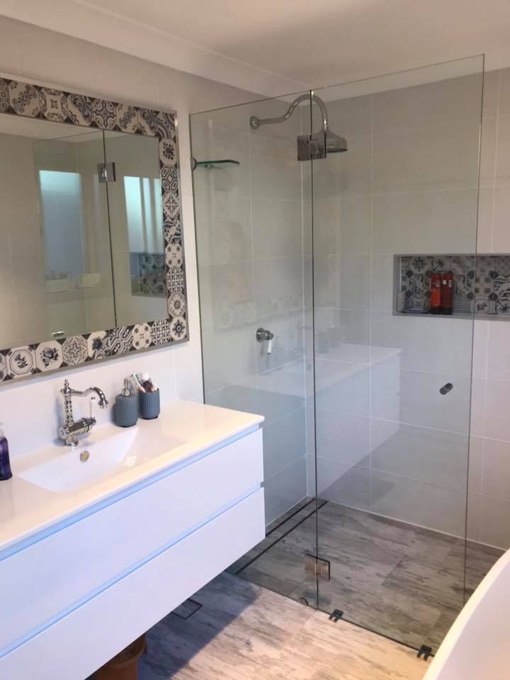 Modern Bathroom with A Glass Shower, White Vanity, and Patterned Tile Accents — Master Glass & Glazing in Belmont, NSW