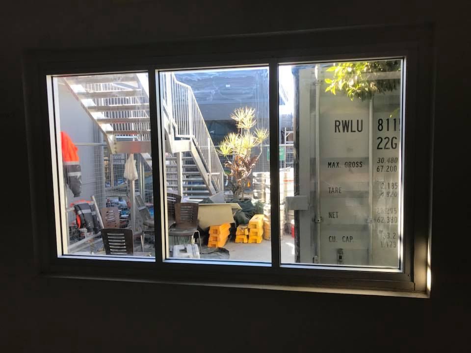 Window View of A Construction Area with A Metal Staircase — Master Glass & Glazing in Warners Bay, NSW