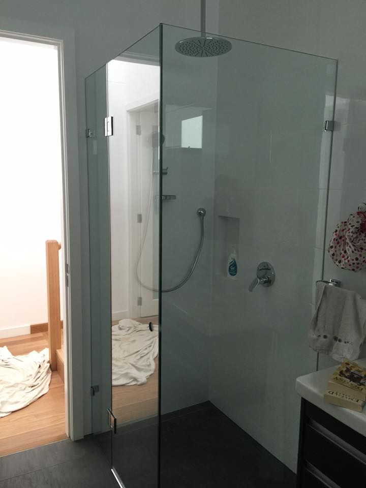 Glass Shower Enclosure with Rain Shower Head, in A Modern Bathroom — Master Glass & Glazing in Maitland, NSW