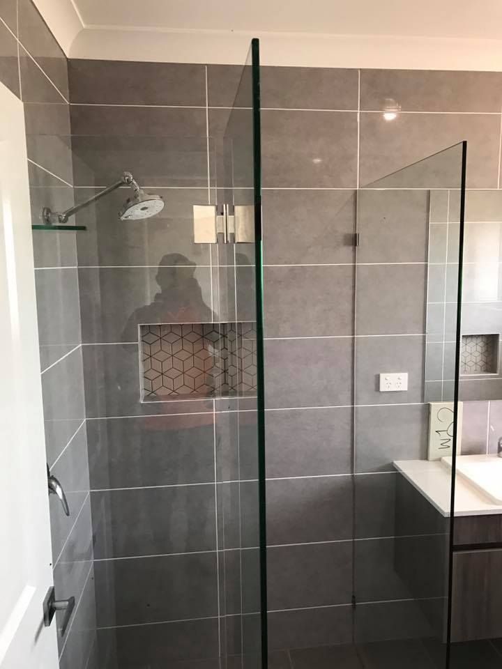 Glass Shower Enclosure with Gray Tiled Walls and A Recessed Shelf — Master Glass & Glazing in Lake Macquarie, NSW