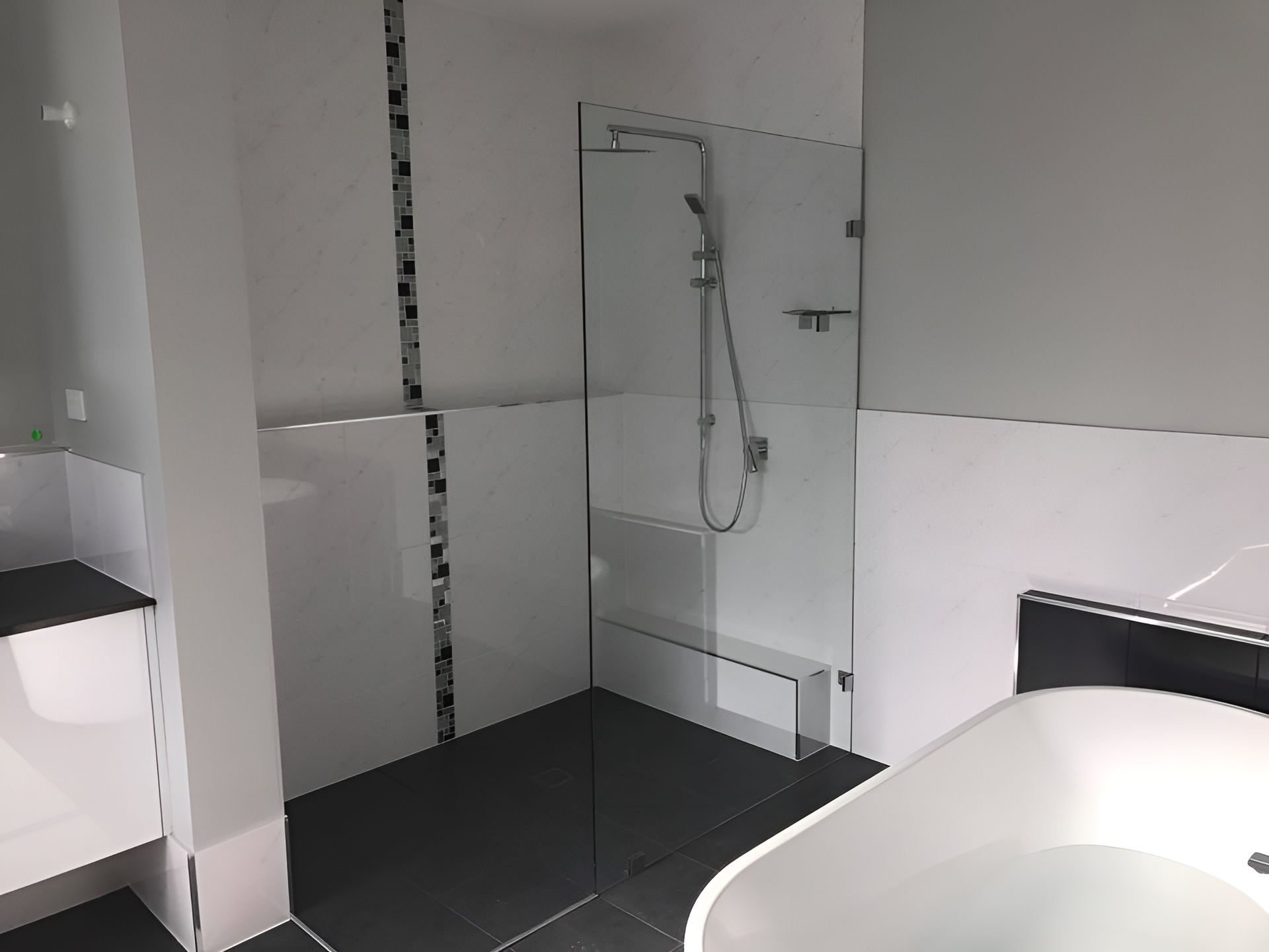 Bathroom with Shower, Glass Door, White and Black Tile, and A Bathtub — Master Glass & Glazing in Newcastle, NSW