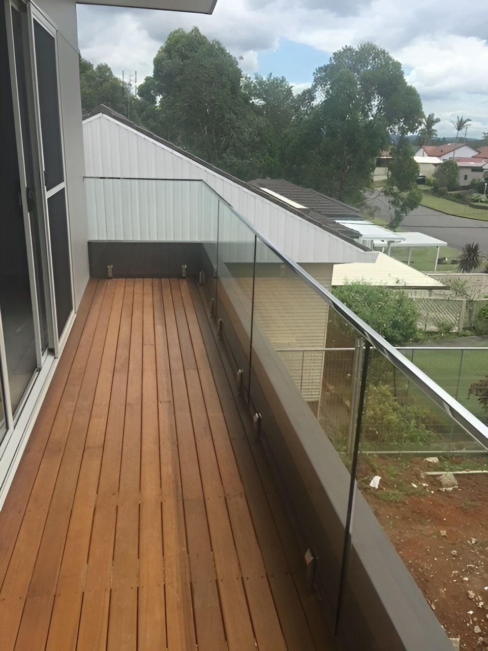 Wooden Deck with Glass Railing, Overlooking Residential Area — Master Glass & Glazing in Newcastle, NSW