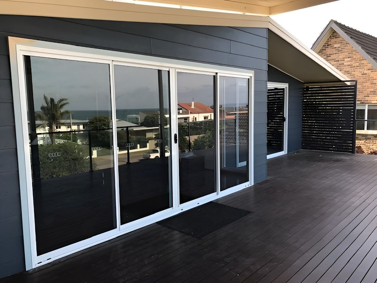 Sliding Glass Doors on Deck, Reflecting Landscape — Master Glass & Glazing in Newcastle, NSW