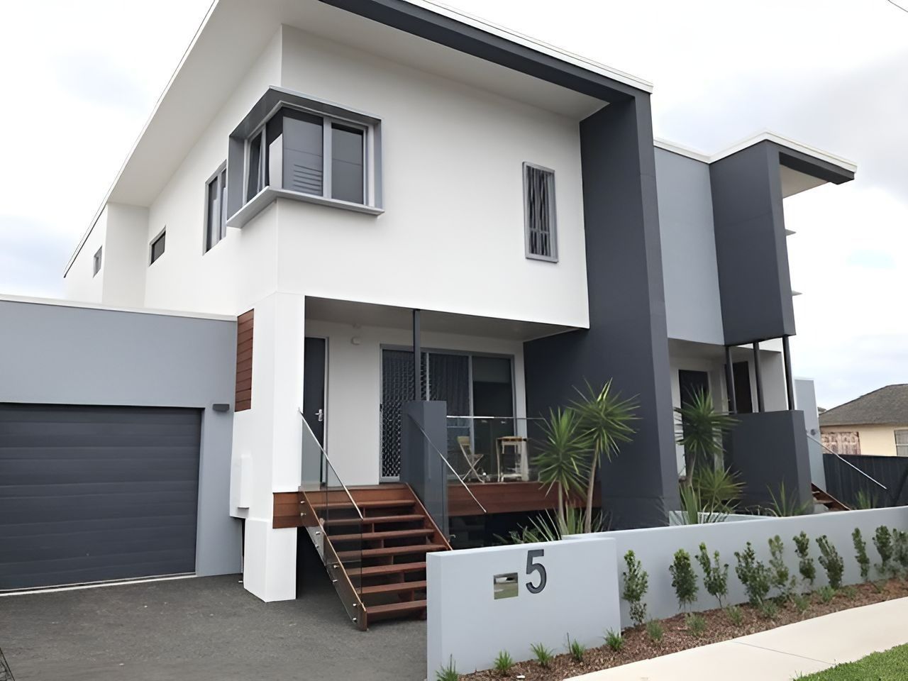 Modern Two-Story House with Gray Accents — Master Glass & Glazing in Newcastle, NSW
