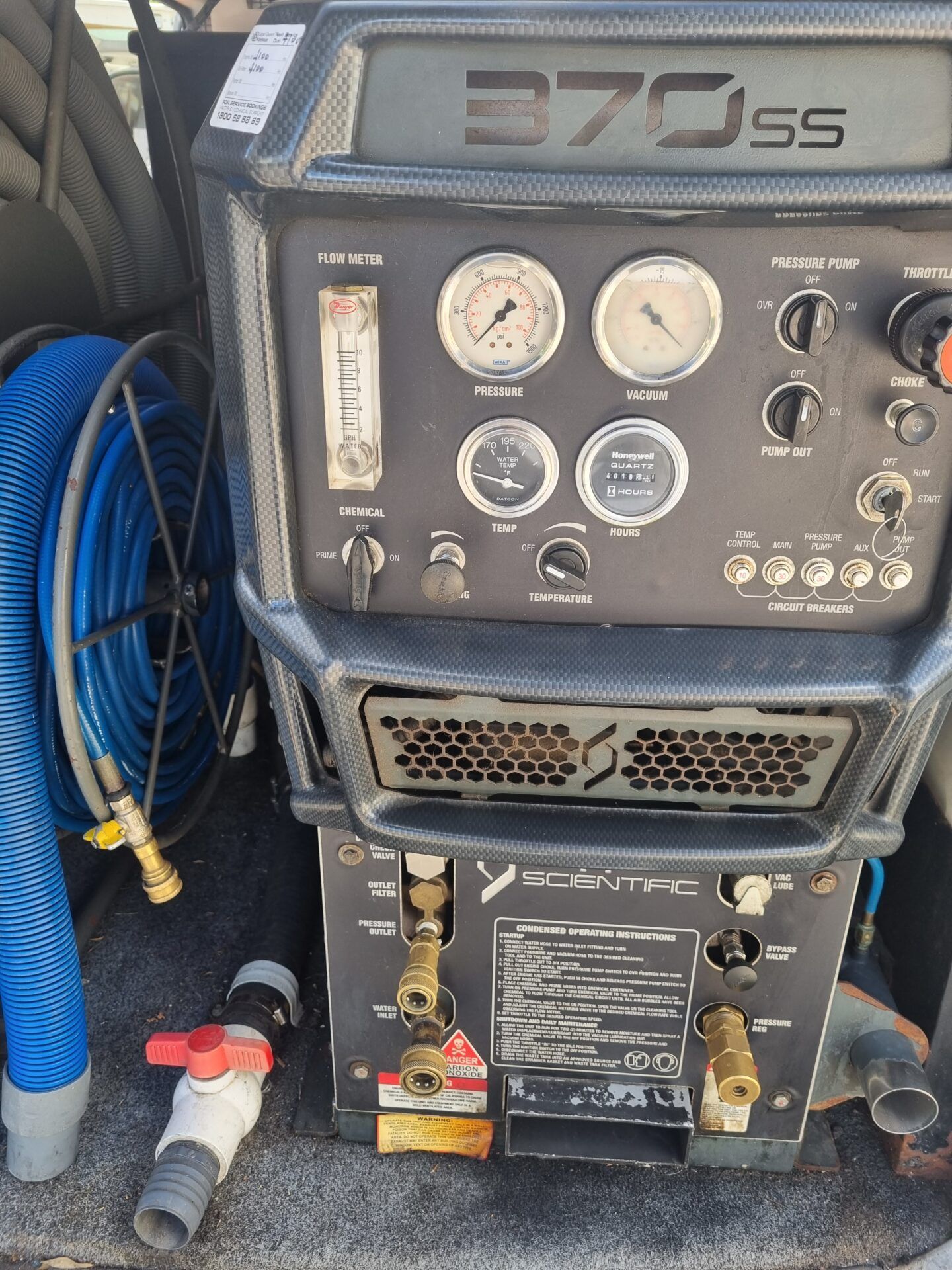 A machine with a lot of buttons and gauges on it.