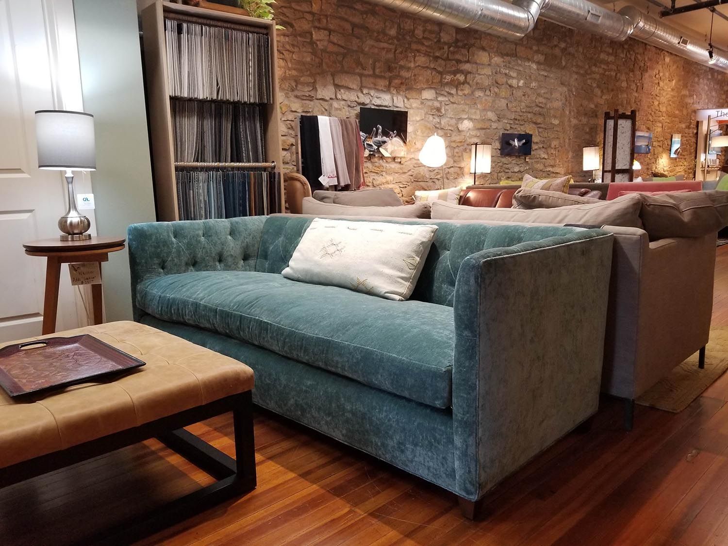 Stunning turquoise velvet modern couch sold by Eagles' Rest Natural Mattresses and Furniture inLawrence, Kansas.