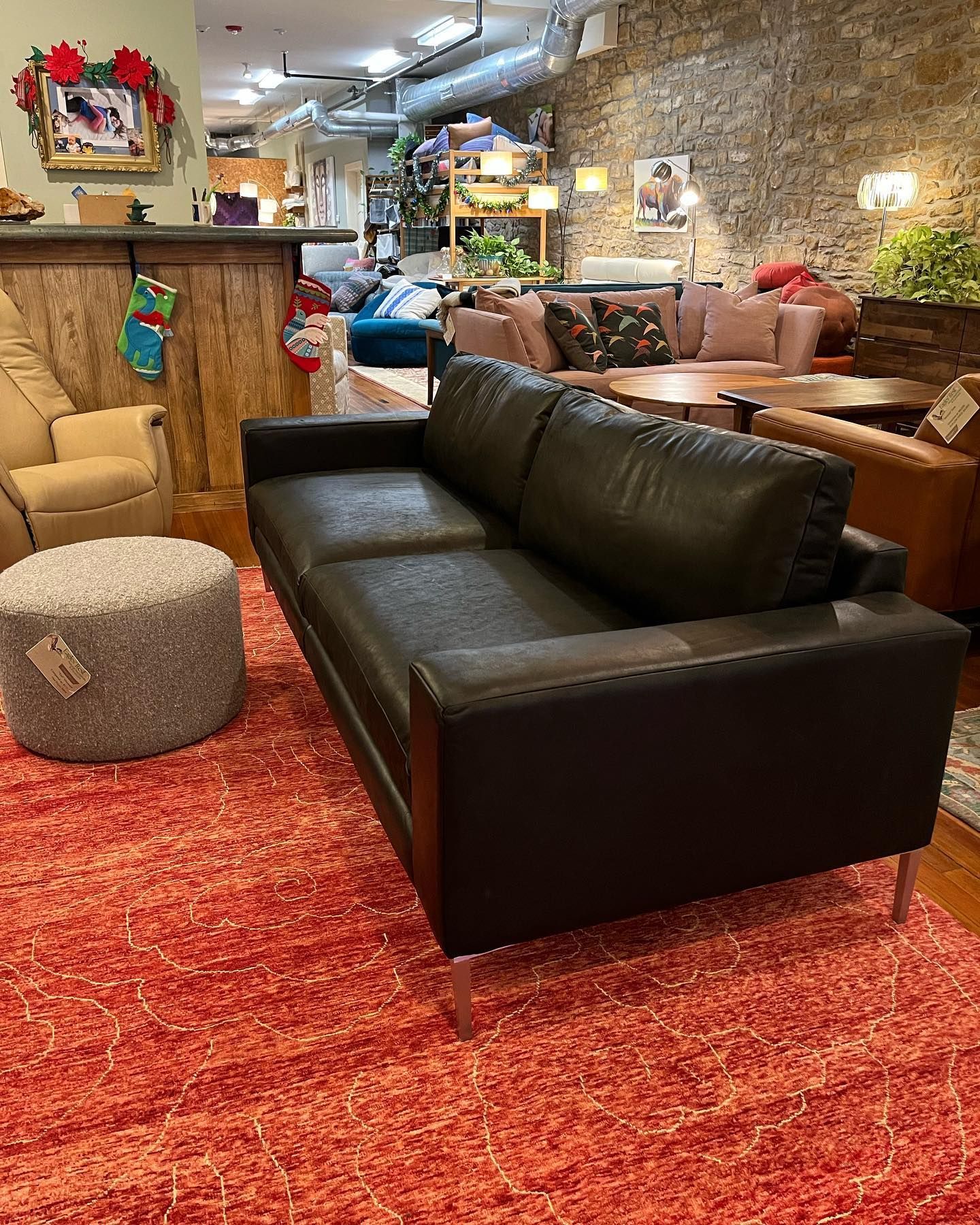 Super stylish black leather couch for sale at Eagles' Rest Natural Mattresses and Furniture inLawrence, Kansas.