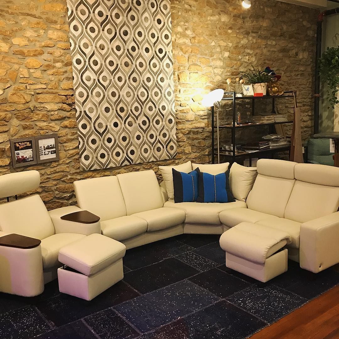 Stunning modern white leather sectional sold at Eagles' Rest Natural Mattresses and Furniture inLawrence, Kansas.