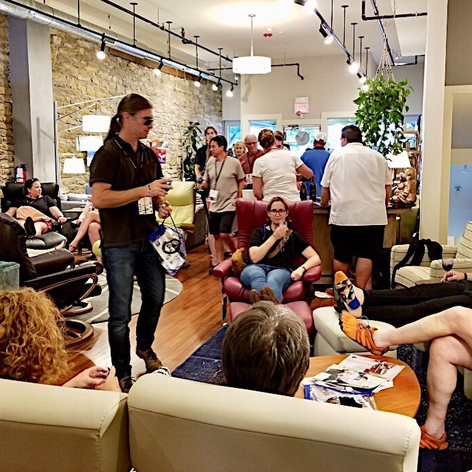 Eagles' Rest Natural Mattresses and Furniture inLawrence, Kansas is having a party and the shop is full of people.