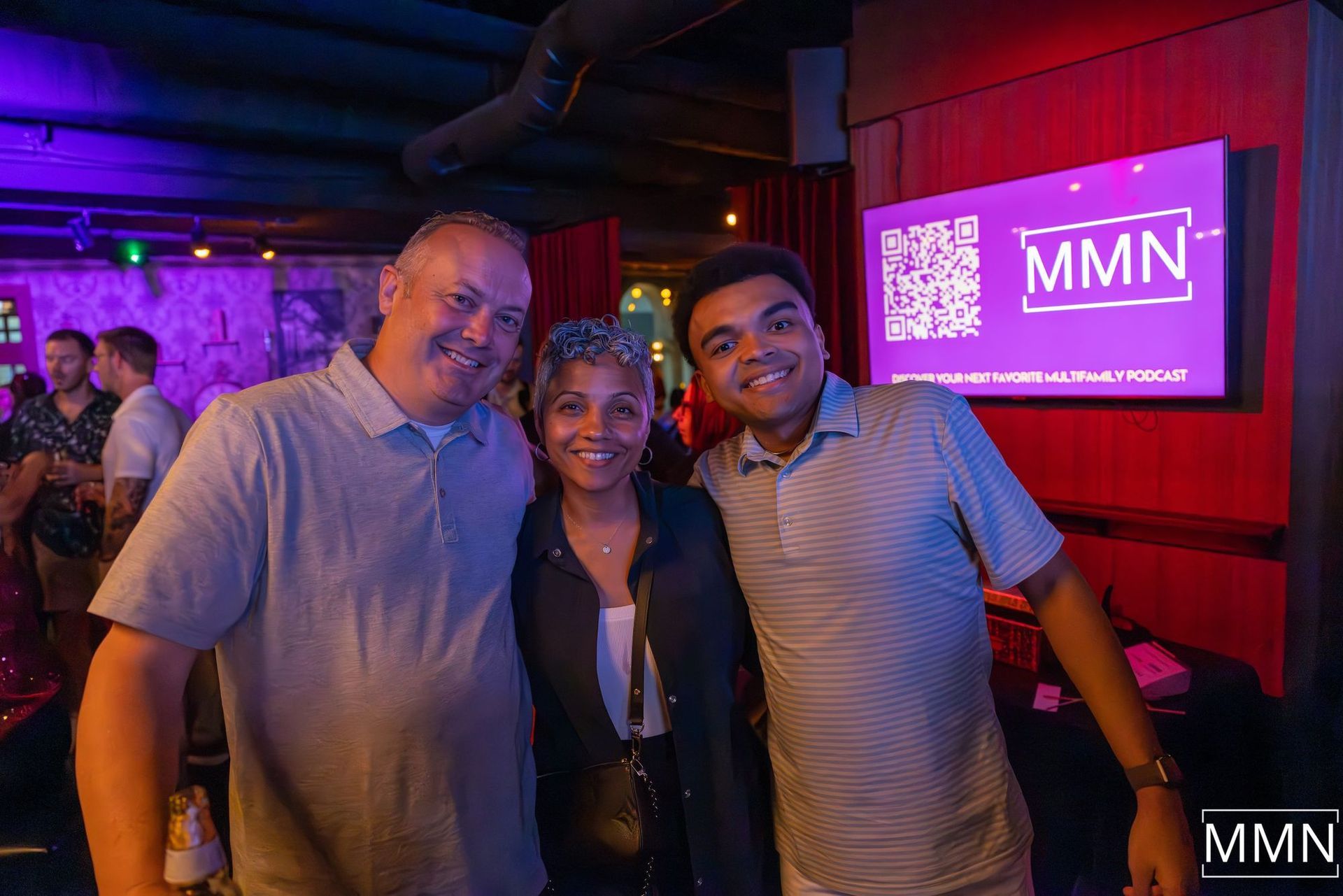 Person wearing headphones, preparing to record audio in a home studio, with microphone and computer.
