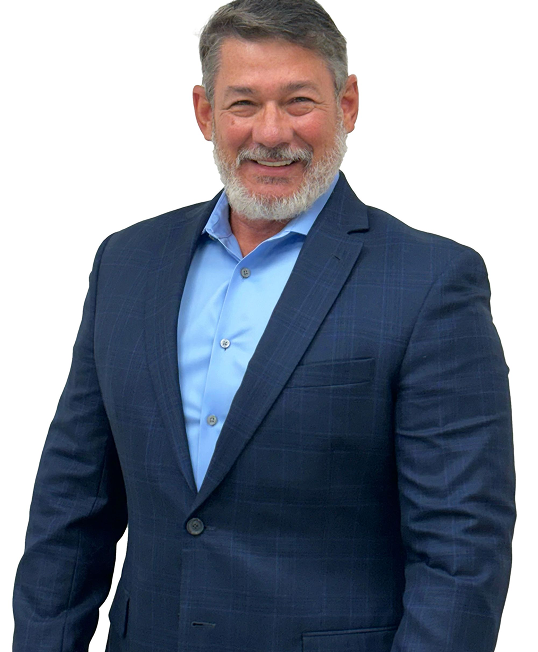 Man in blue blazer and shirt smiling, studio shot.