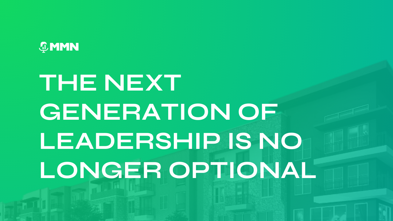 Woman in red blazer holding a pen, leaning on a red chair near a window.