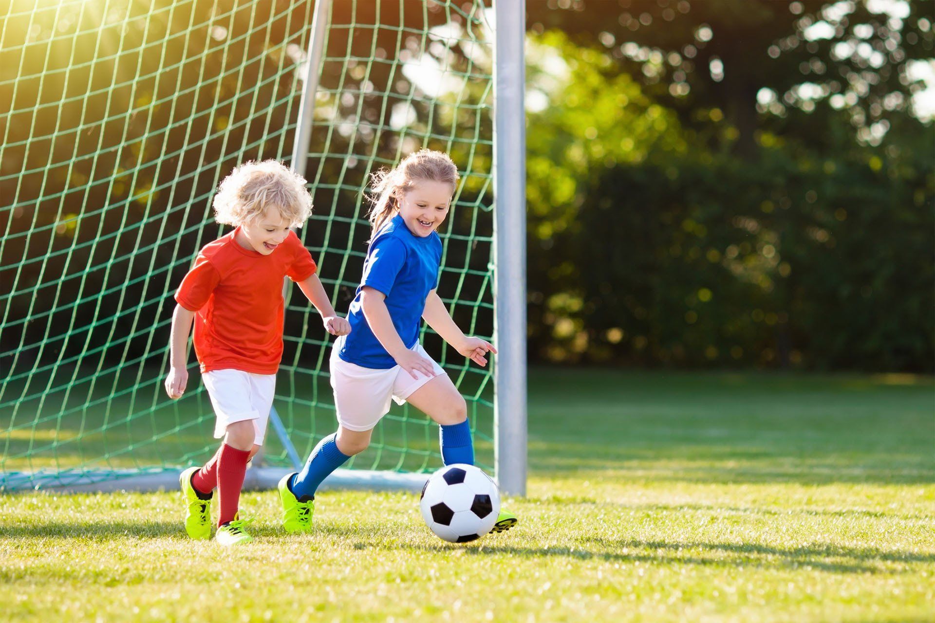 Kids Playing Football — Baton Rouge, LA — A Lil One’s Learning Center