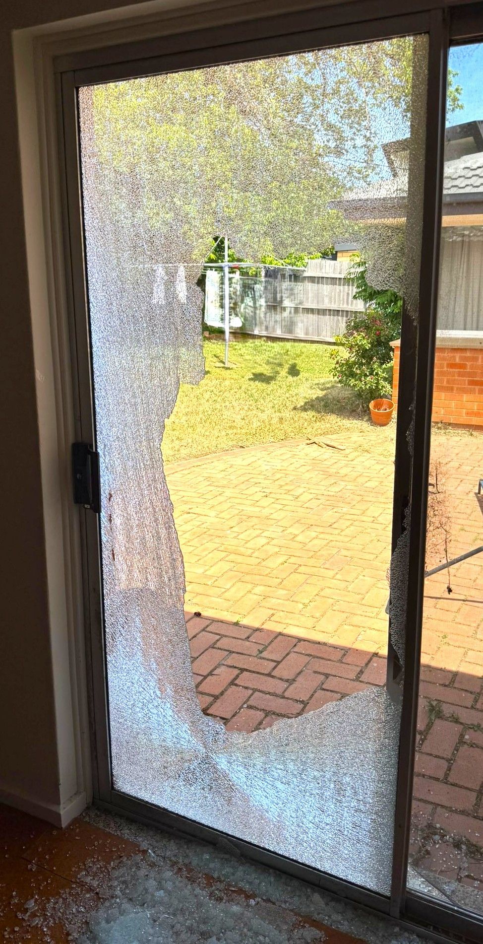 View of a broken backyard window.