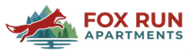 Fox Run Apartments pet-friendly Waynesville NC logo with a leaping red fox and teal mountains.