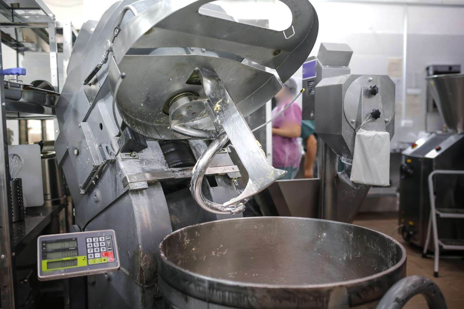 Commercial Food Equipment Industrial dough mixer with spiral hook and control panel used in commercial food prep.