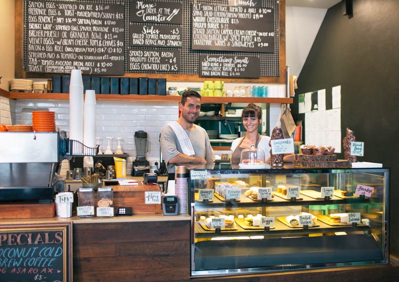 happy people working at cafe