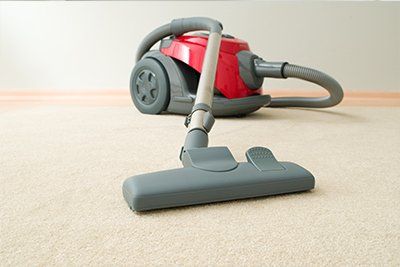 vacuum cleaner on clean carpet