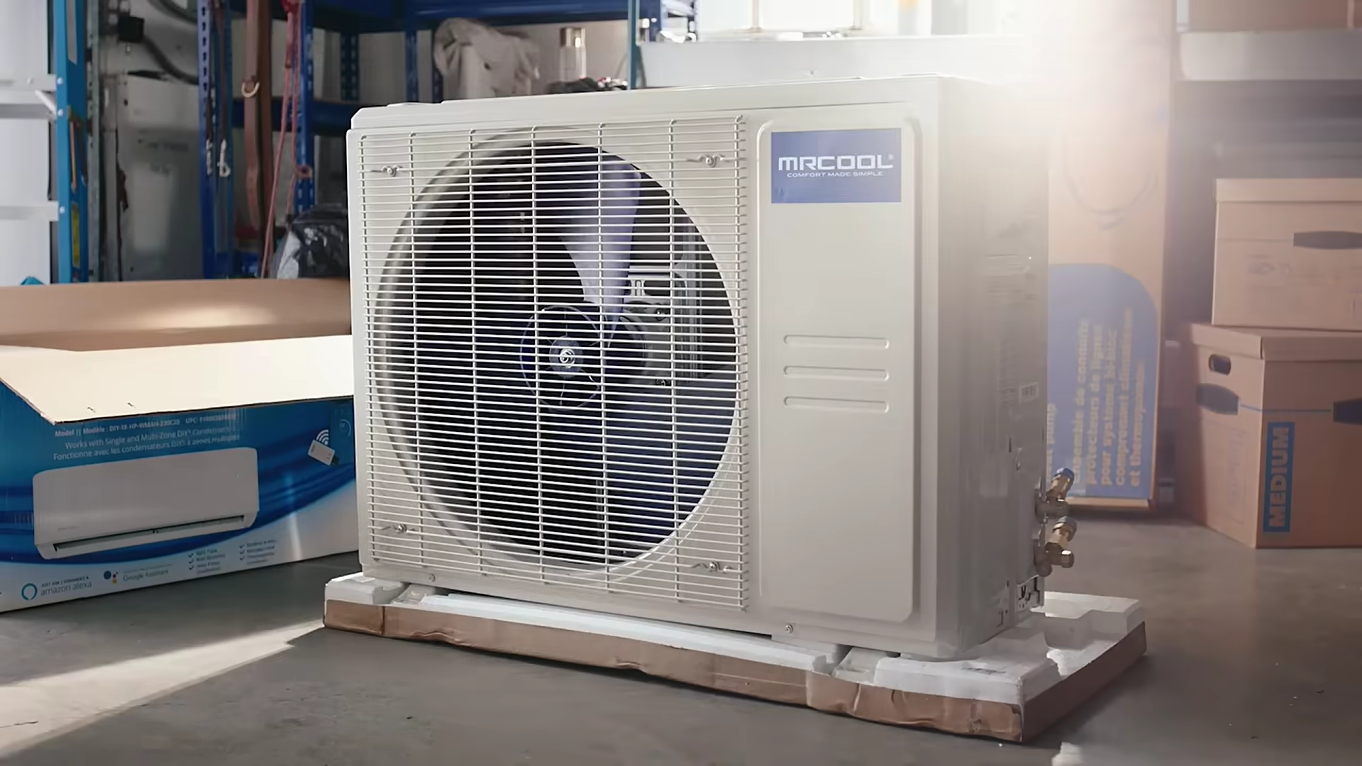 Outdoor air conditioning unit, light tan color, in storage area, sunlight.