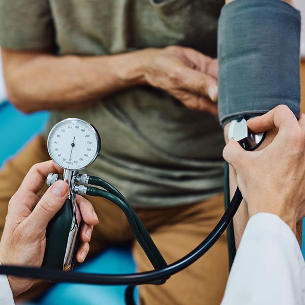 Man with hypertension is getting his blood pressure checked