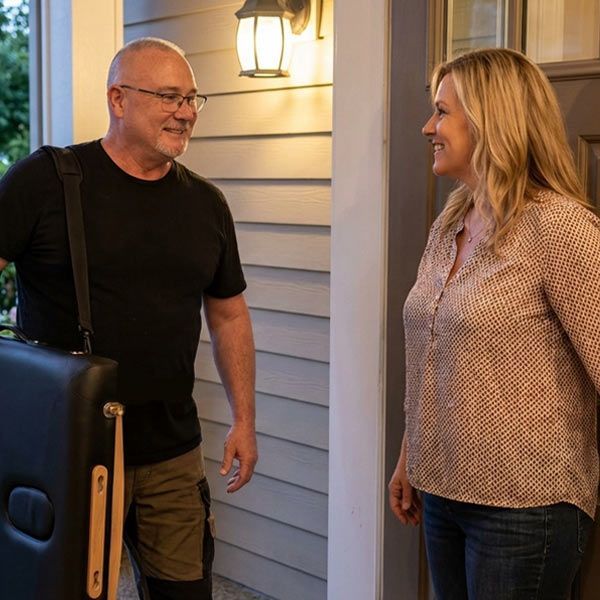 Robert Pineau is arriving at a patient's house for an in-home massage session
