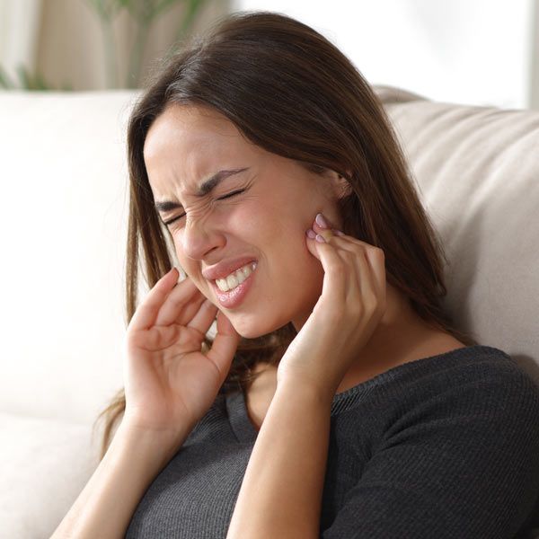woman with excessive TMJ and jaw Pain
