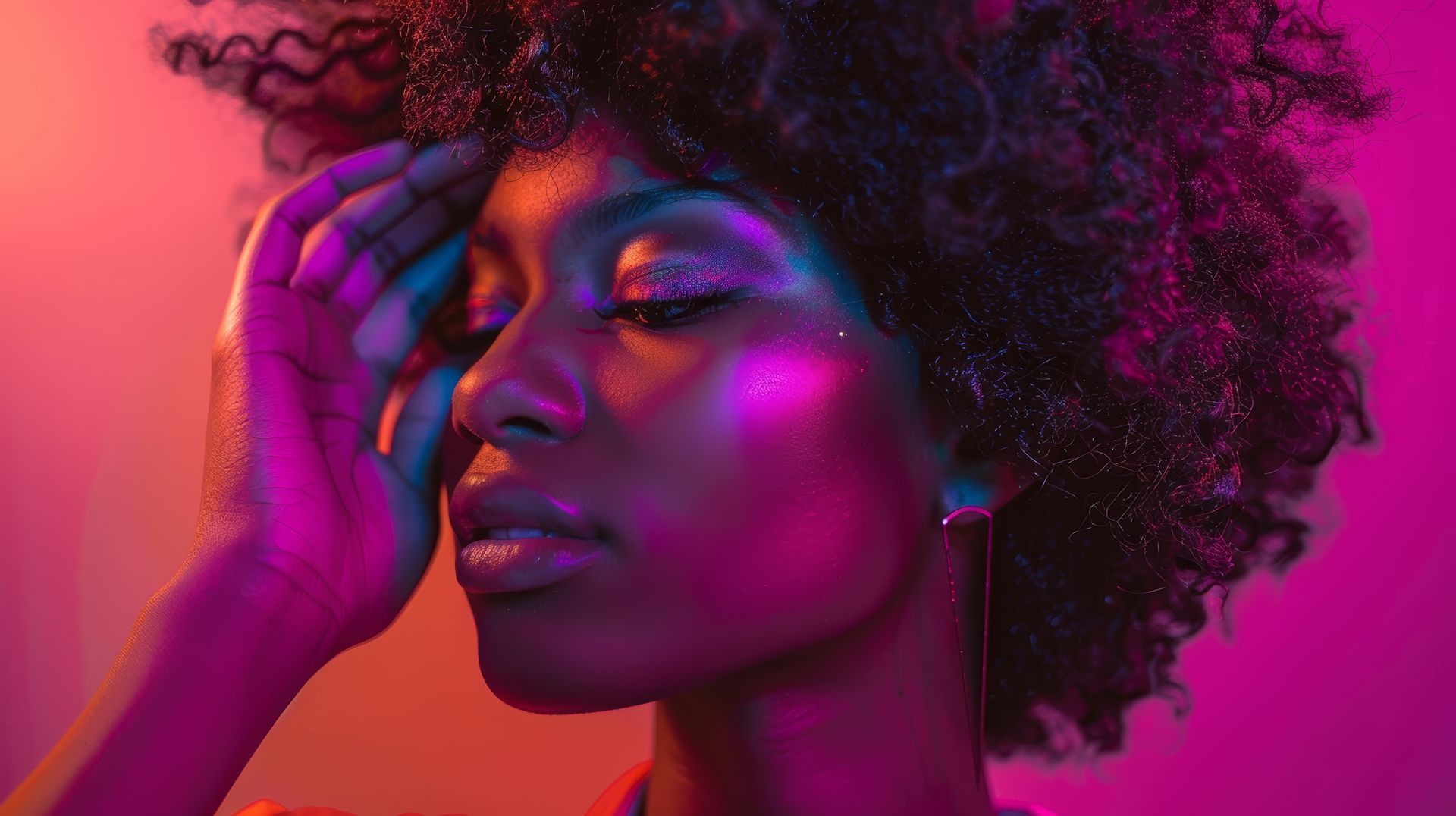 A close up of a woman 's face with purple and pink lights behind her.