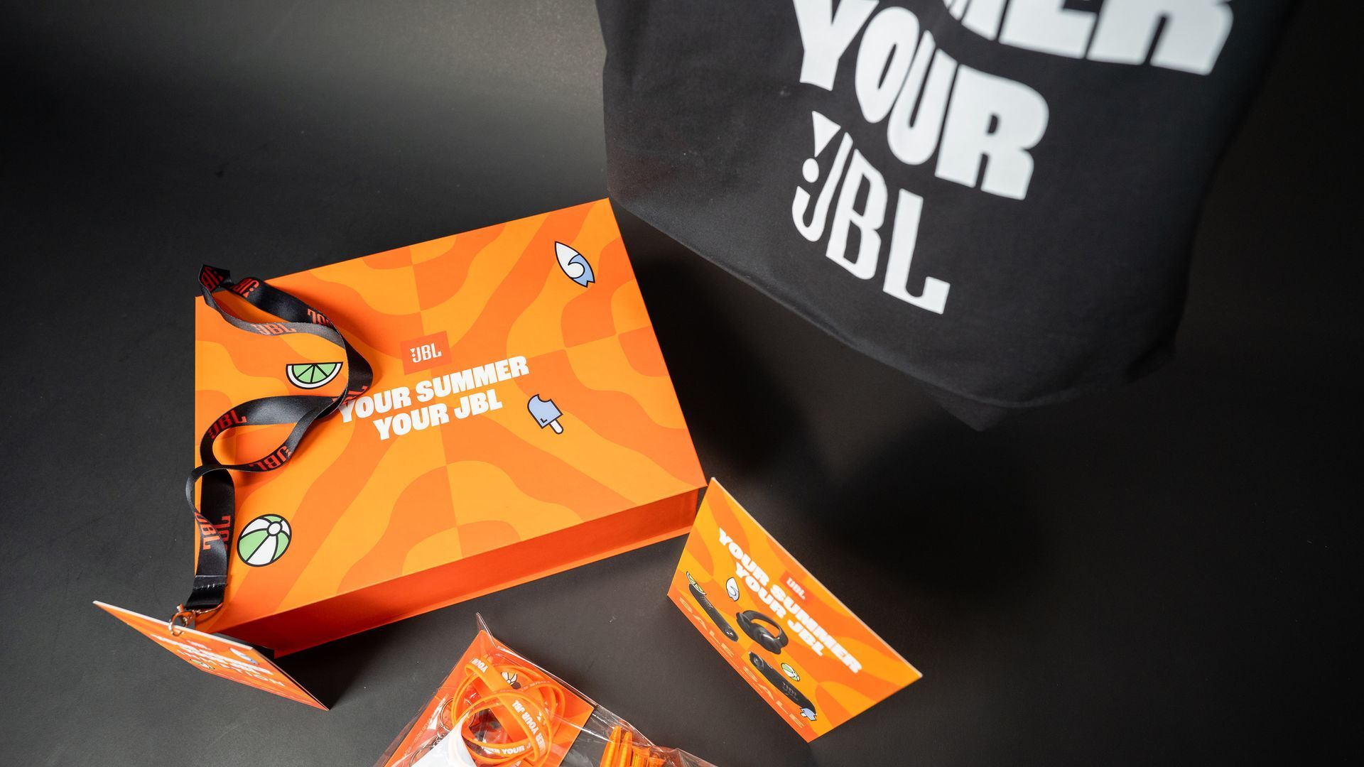 Bright orange JBL PR gift box included custom tote bag designed and produced by branded boxes.