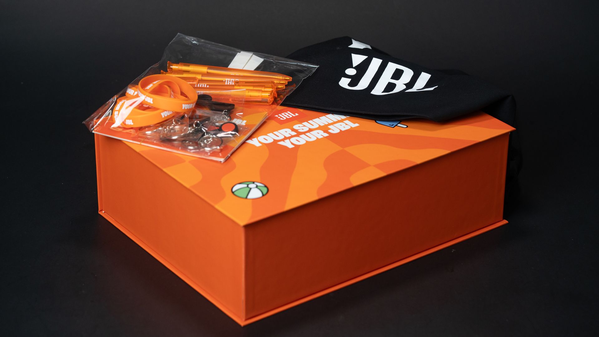 Bright orange JBL PR gift box designed and produced by branded boxes.