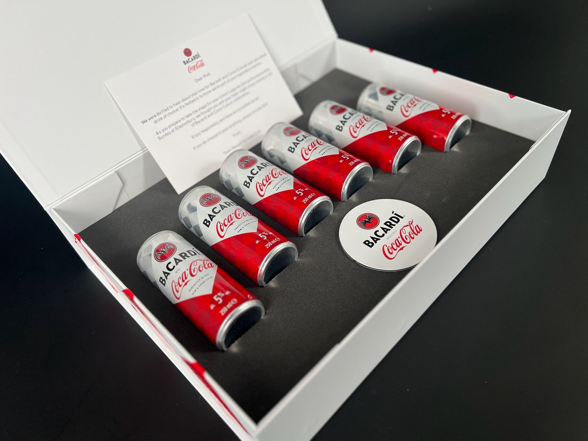 bespoke fitment box with bacardi fitment holding an assortment of cans.