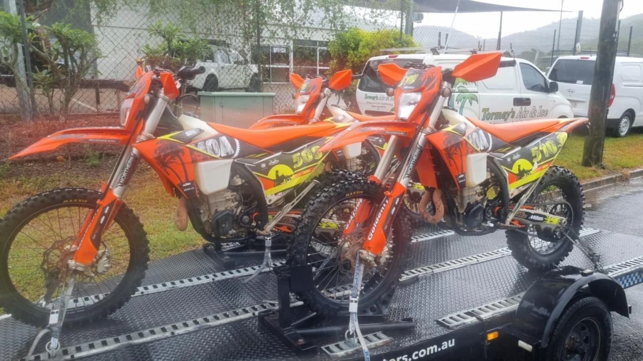 Two Dirt Bikes Are Parked Next To Each Other On A Trailer — Motorcycle Transporters In Manunda, QLD