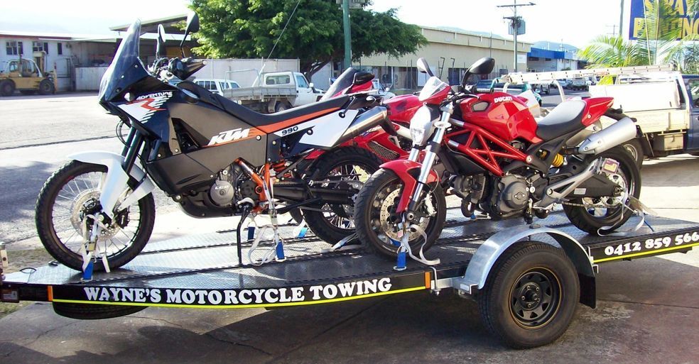 Two Motorcycles Are On A Trailer — Motorcycle Transporters In Manunda, QLD