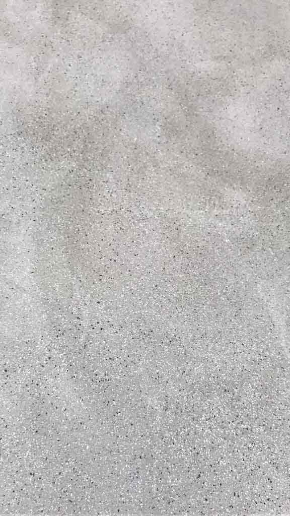 venezia stucco detail of salt and pepper botticino product with white and black small point all over the panel