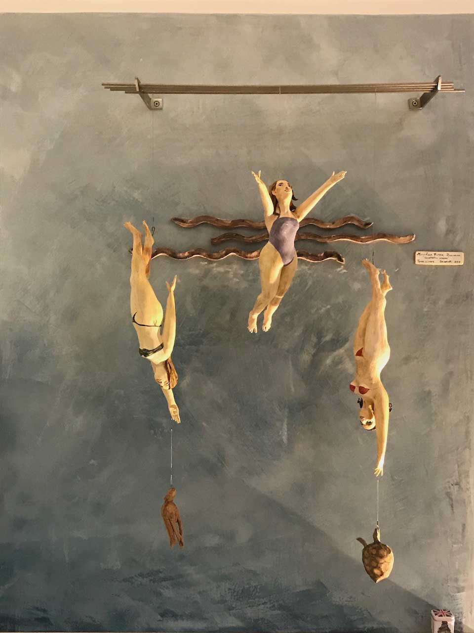 image of a painting of three women on a marmorino veneziano wall