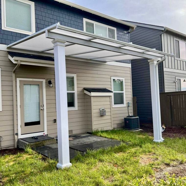 After Crown Patio Covers installed a 16’ x 12’ white-frame patio cover with Cool Blue panels in Northwest Portland