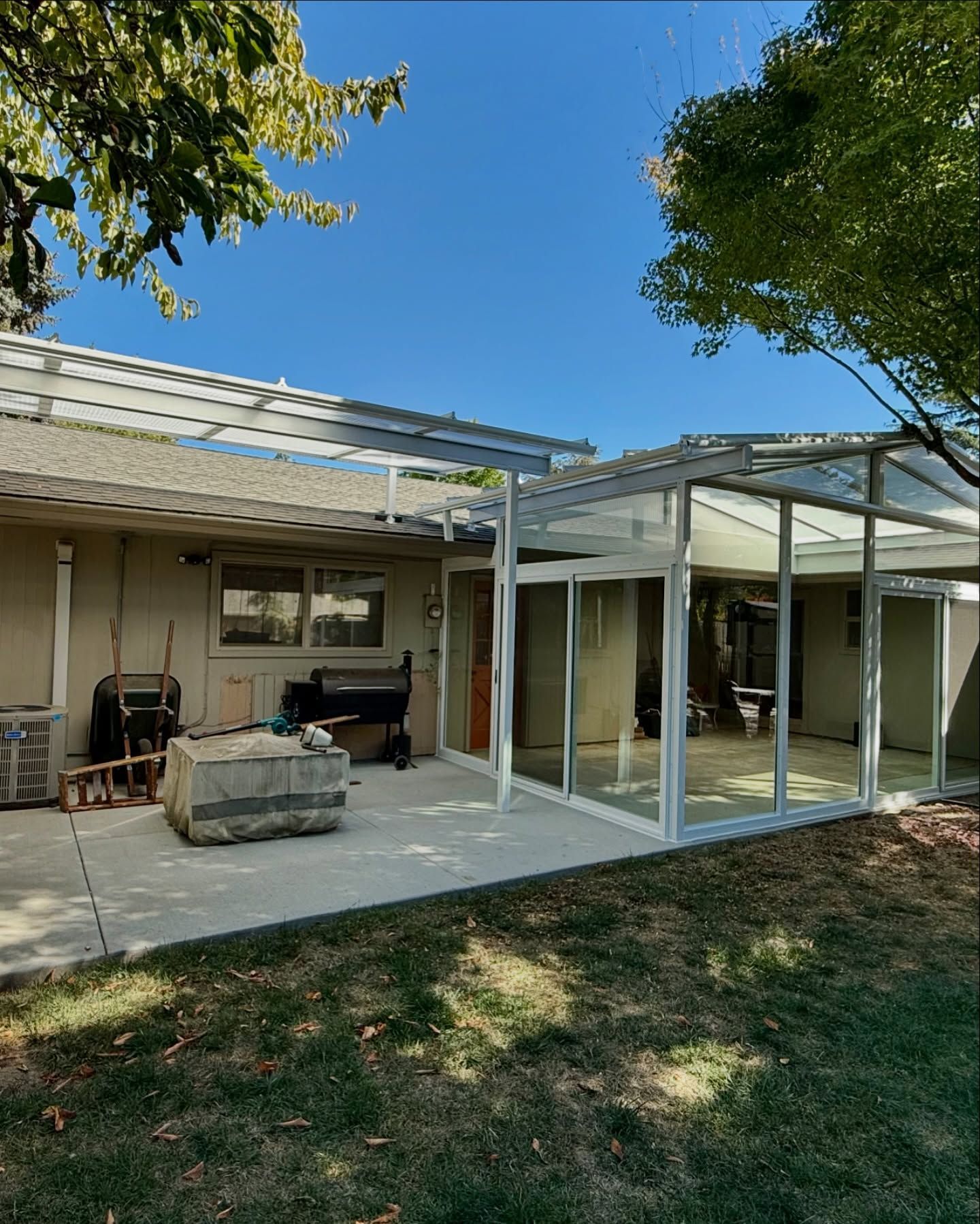 After Crown Patio Covers Installed a Custom Enclosure Room in Bethany Featuring Dual White Patio Covers