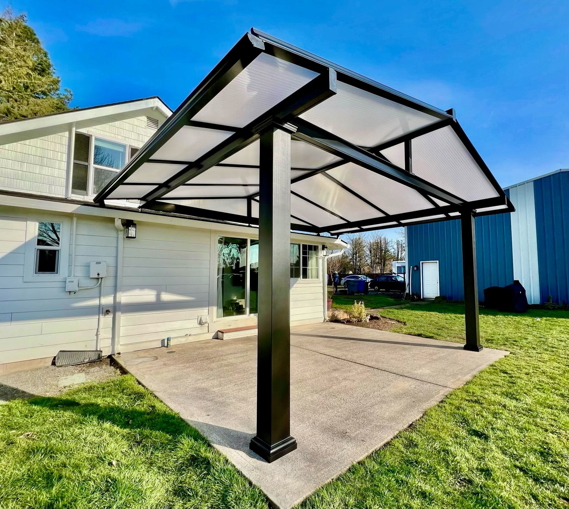 Battle Ground Washington Patio Cover Project - Black Gable Frame with Acrylite Acrylite Cover installed by Crown Patio Covers