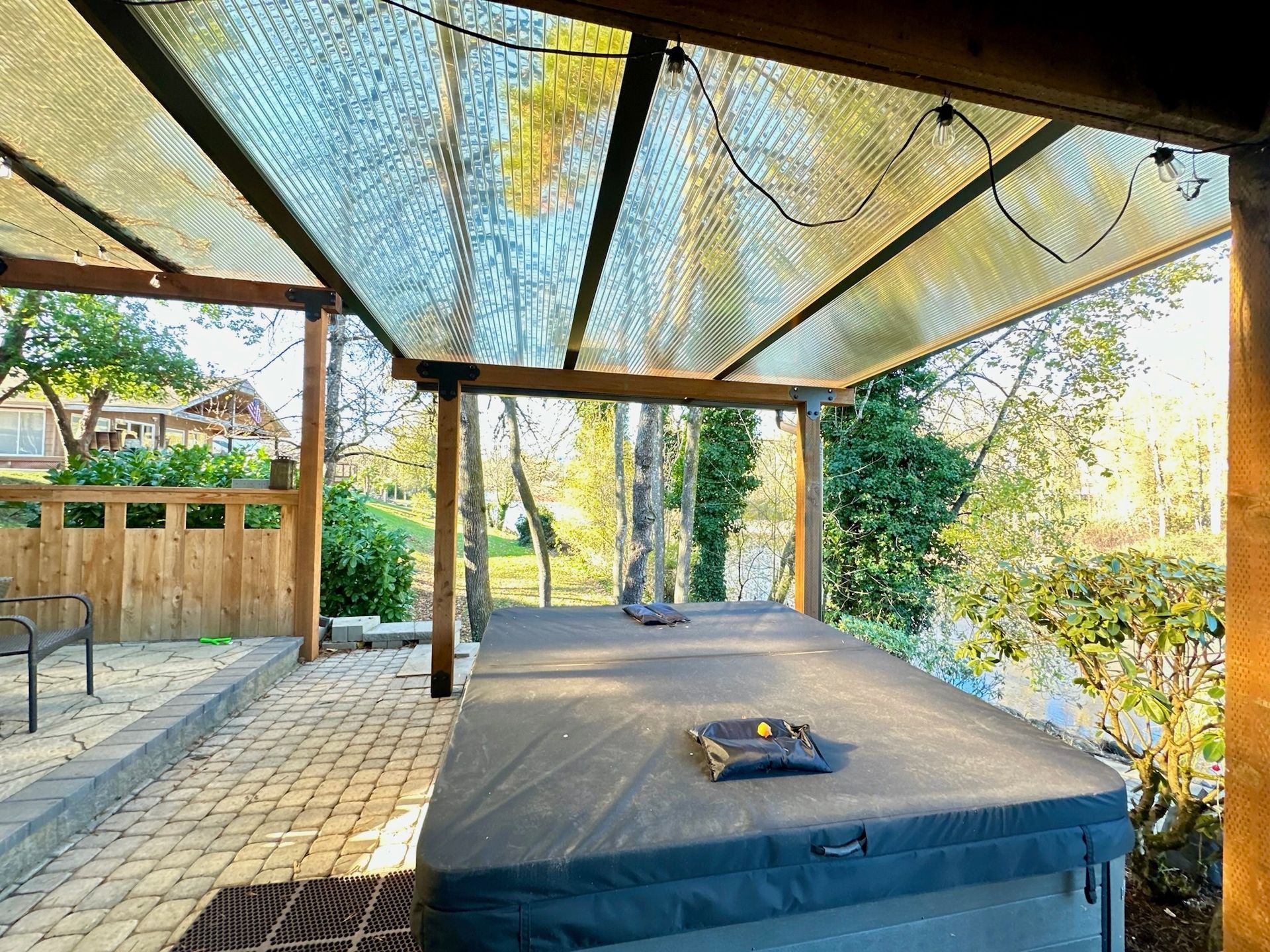 Bethany area patio cover project - Cedar and Bronze frame with Acrylite acrylic daylight acrylic built by Crown Patio Covers