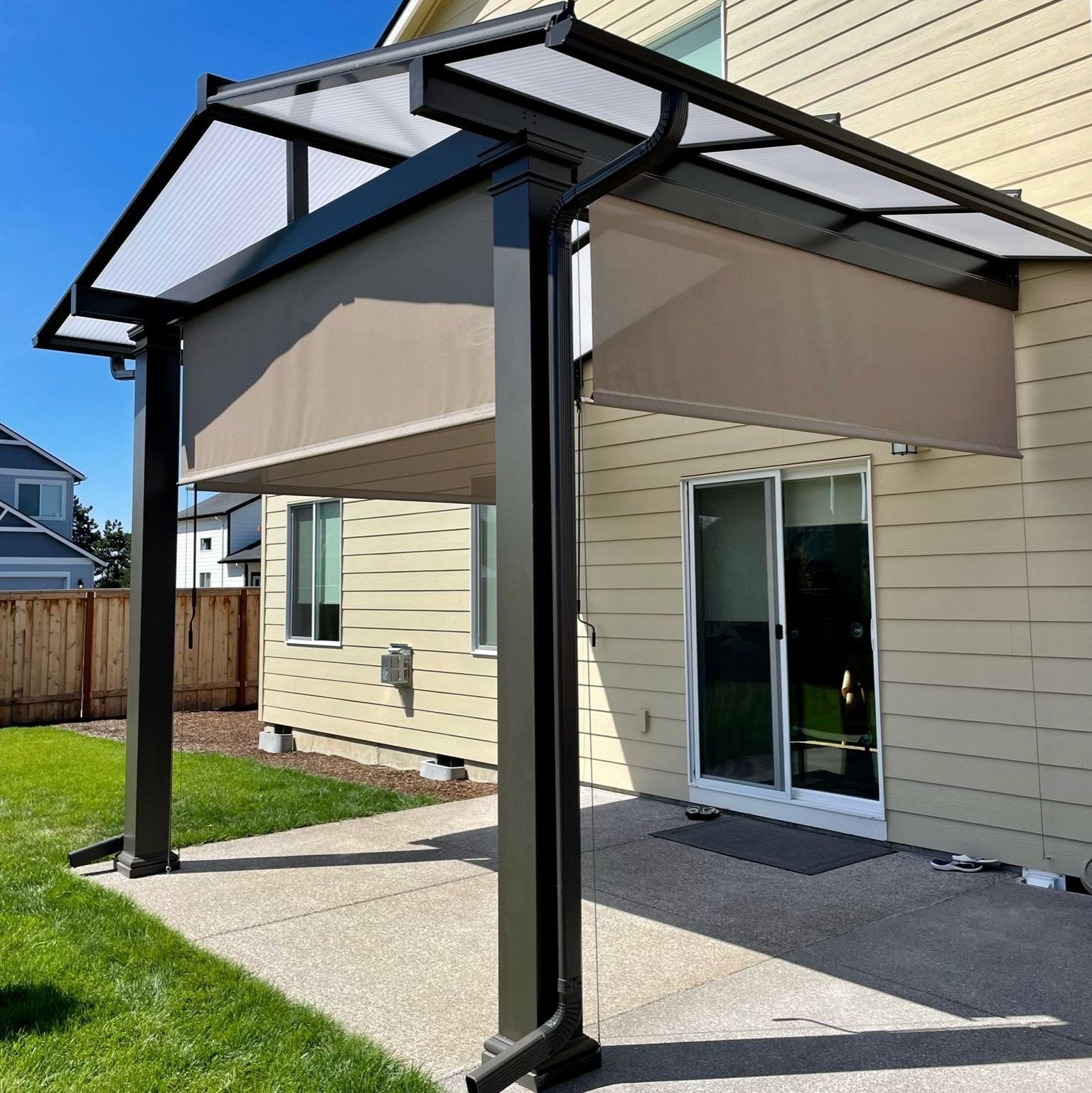 Portland Patio Cover with Track Shade System - Shad half down on Patio Cover