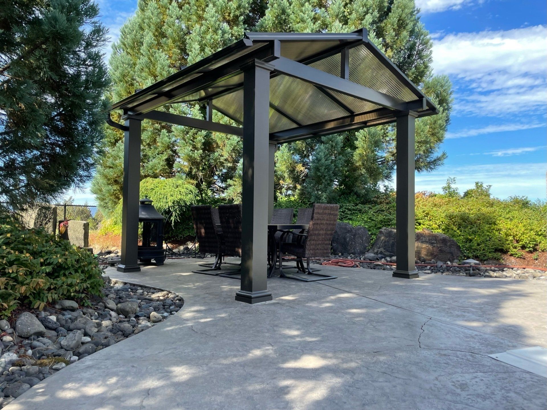Patio Cover Contractor in Portland - Crown Patio Covers - Gable Style Frame in Dark Bronze with Acrylite Acrylic Top