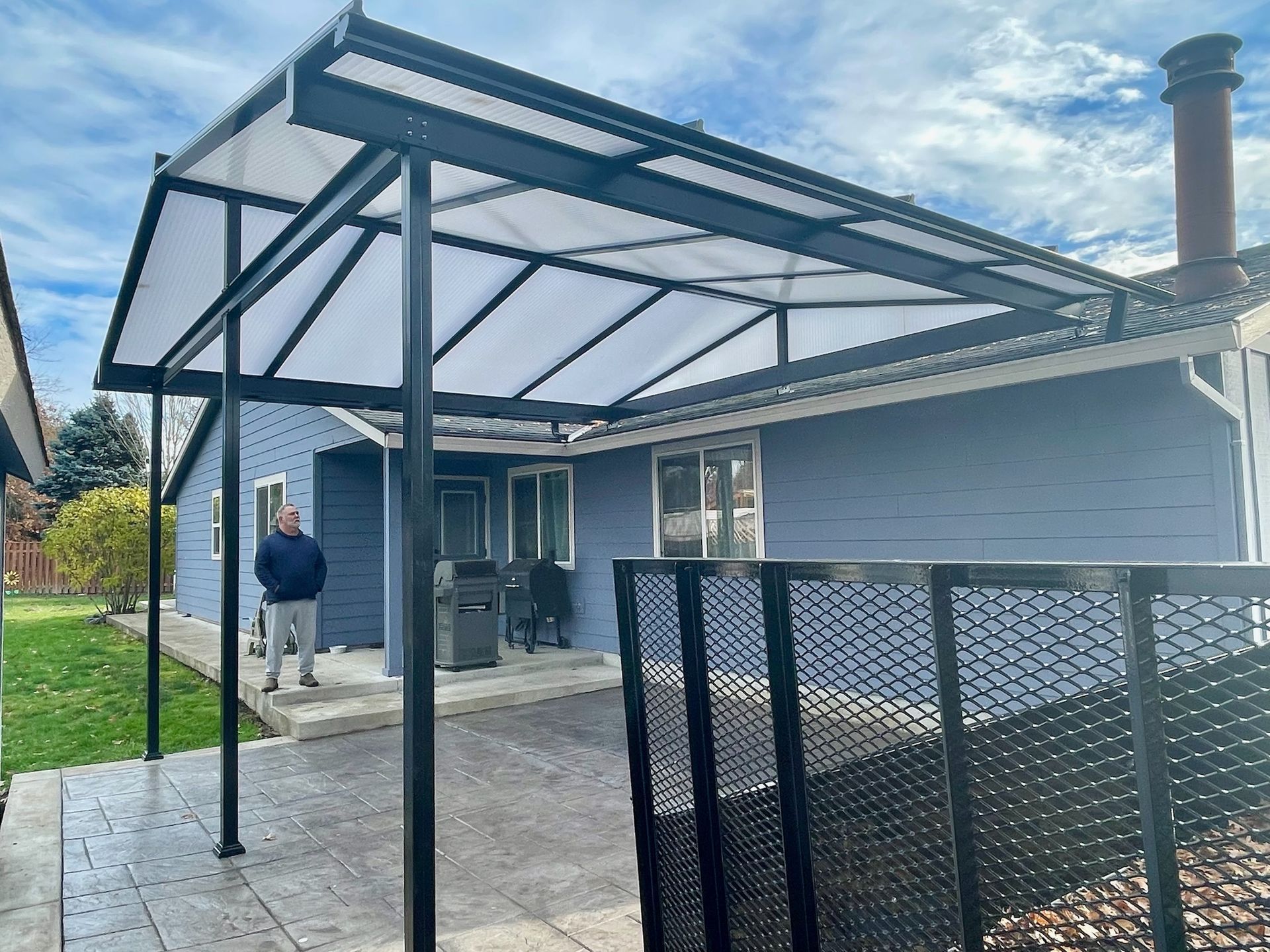 Hillsboro Patio Cover Project - Black Gable Frame with Acrylite Acrylic Top Installed by Crown patio Covers the top Patio Cover Contractor