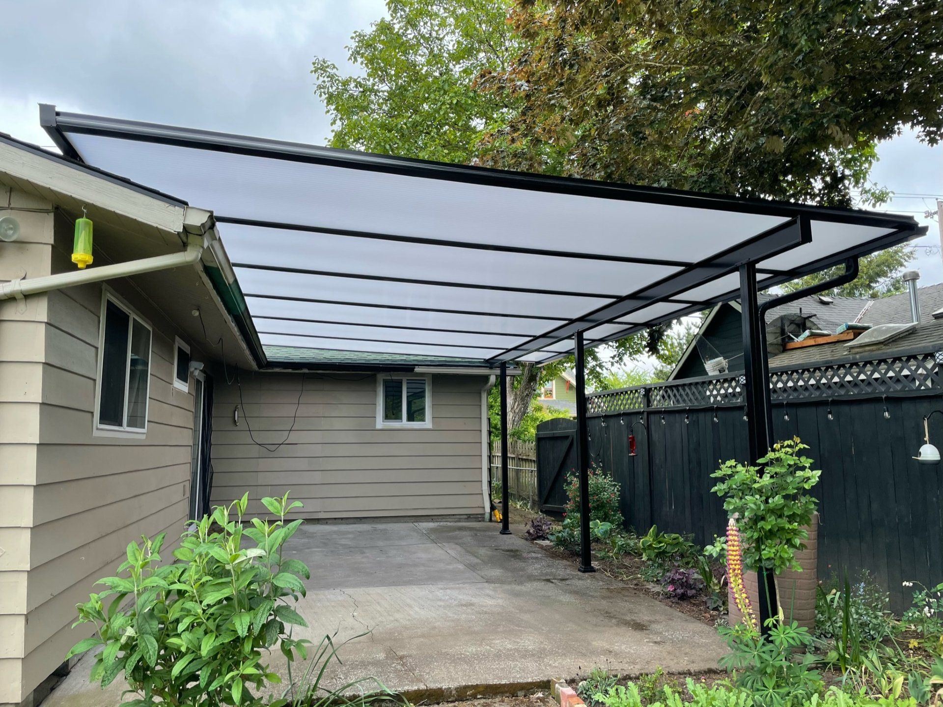 Patio Cover in Portland with Black Shed Style Frame  Acylite Acrylic Roof