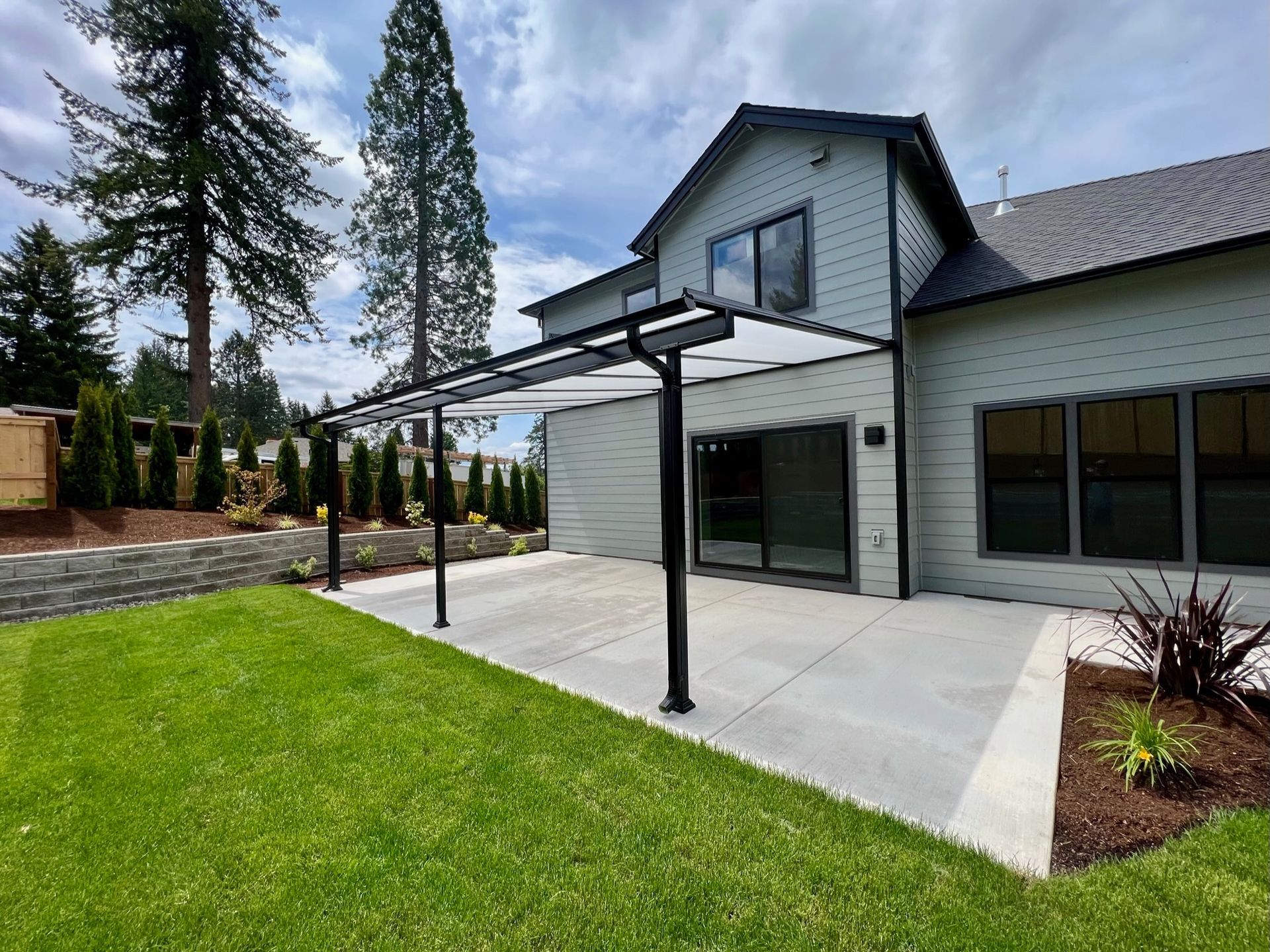 Sandy Oregon Patio Cover Project - Shed Patio Cover with Black Frame and Acrylite acrylic top - Crown Patio Covers LLC