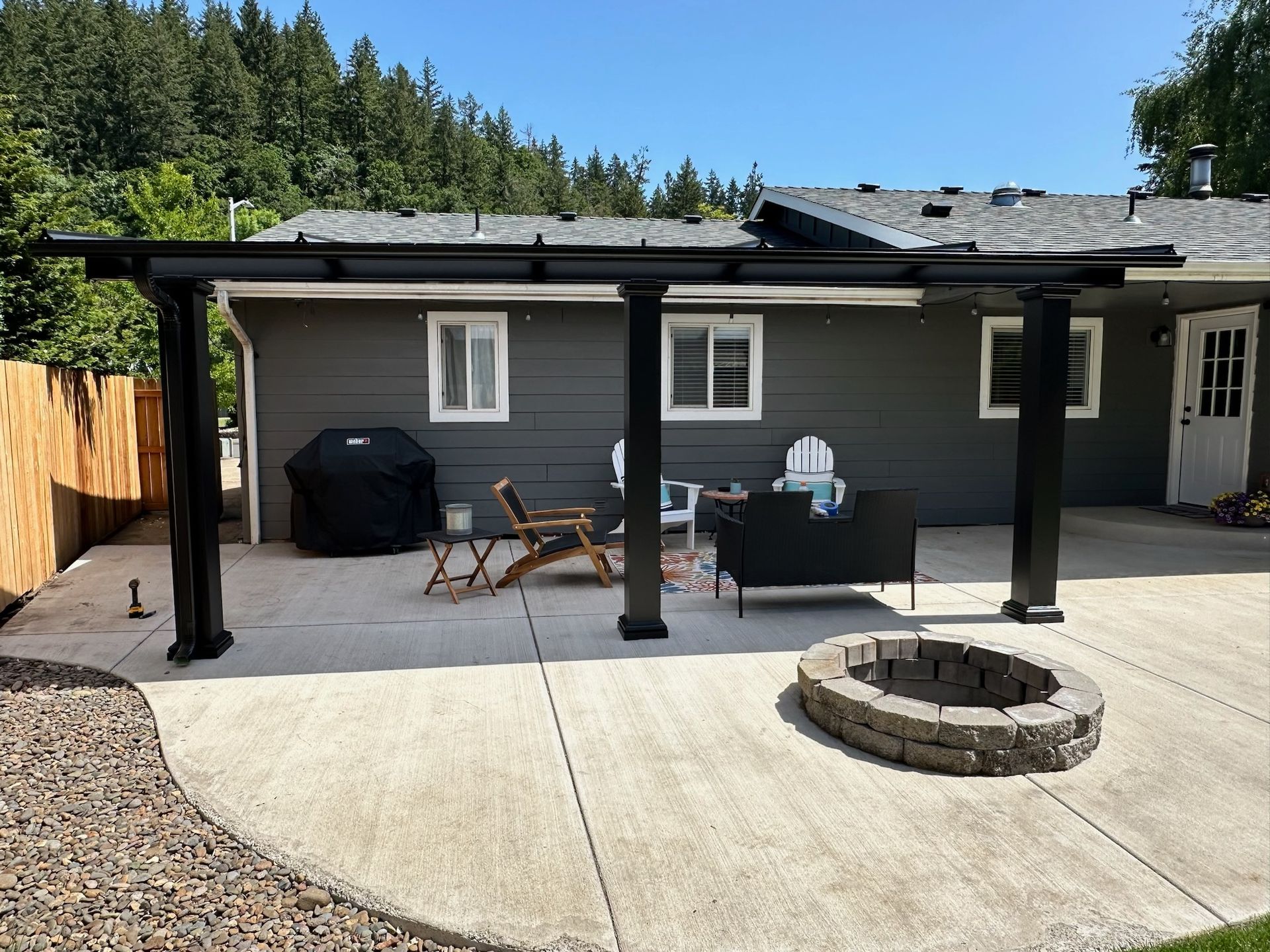 Silverton Oregon Patio Cover Build by Crown Patio Covers - Black Shed Frame Cool Blue Top