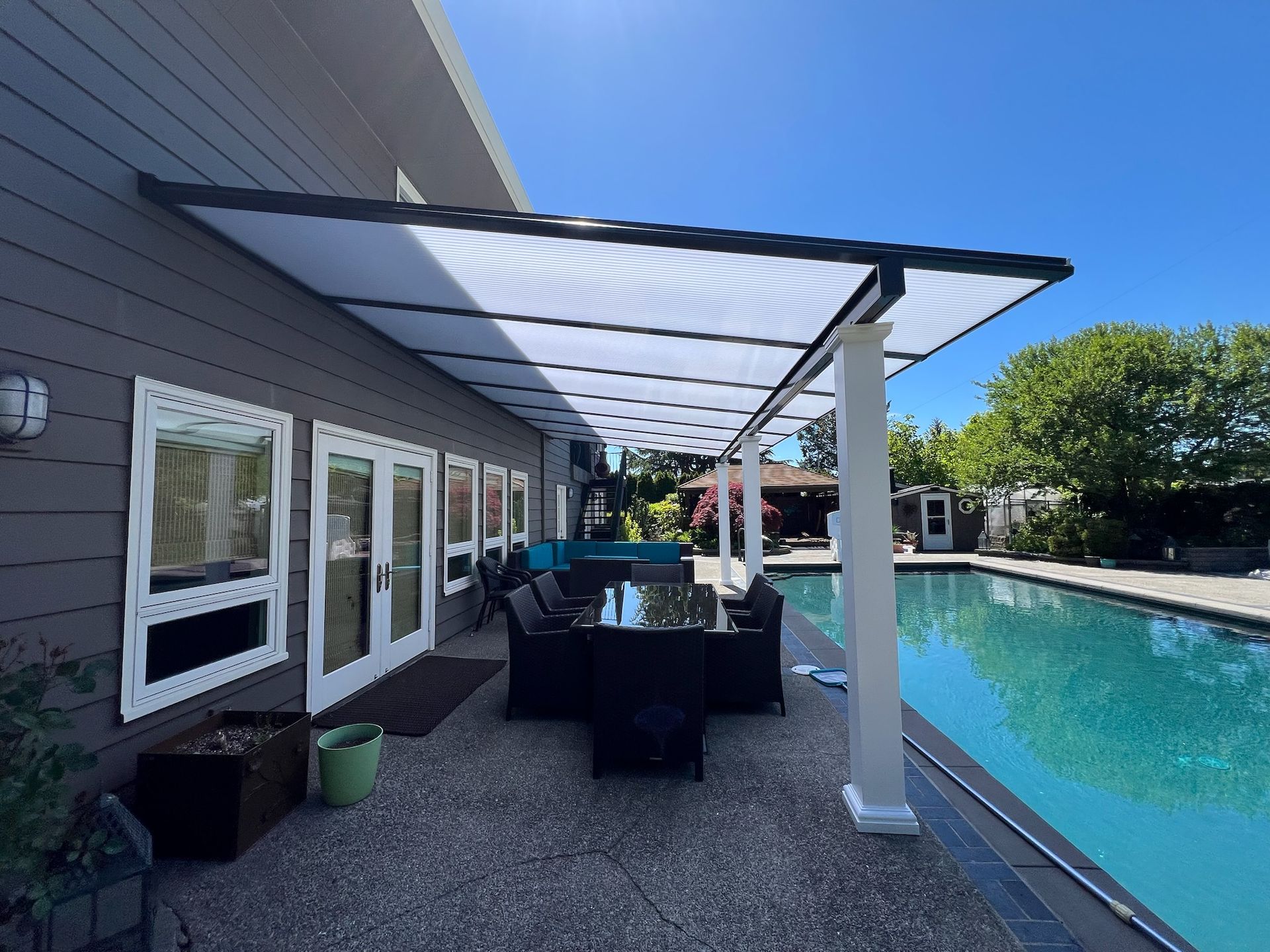 West Portland Patio Cover Build - Shed style cover with white posts and black top with Acrylite acrylic HeatStop cover by Crown Patio Covers LLC