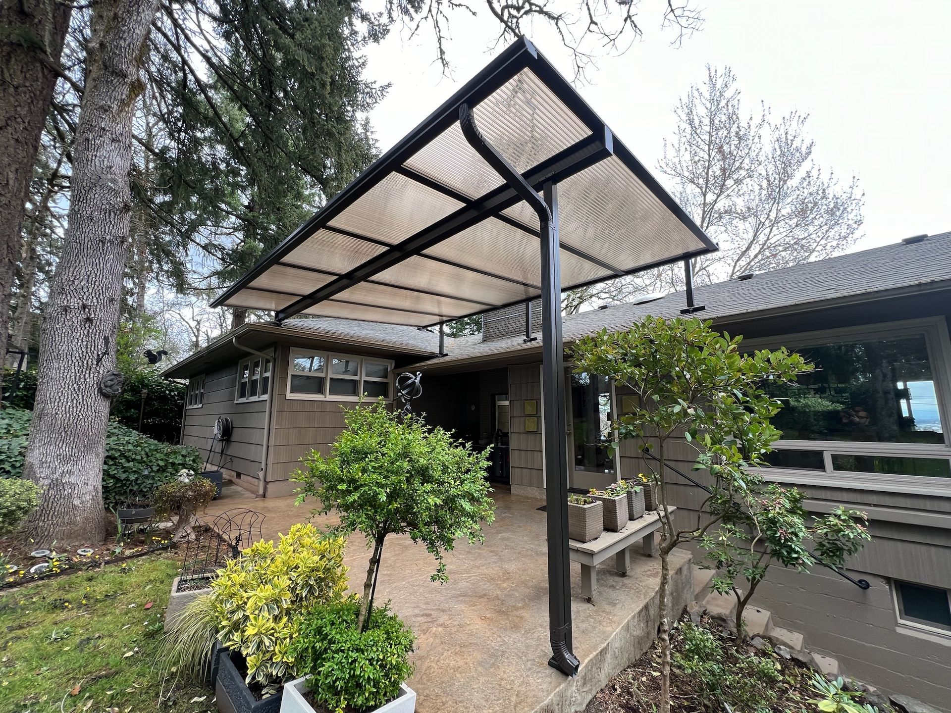 West Salem Oregon Patio Cover Project - Raised Cover in Bronze with Acrylite acrylic top by Crown Patio Covers LLC the top Patio Cover Contractor